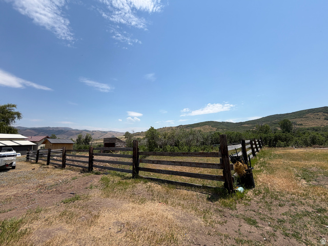 785 Hardscrabble Road Morgan, UT 84050 - Photo 11 of 16 Spacious outdoor area featuring a wooden fence line and natural landscaping