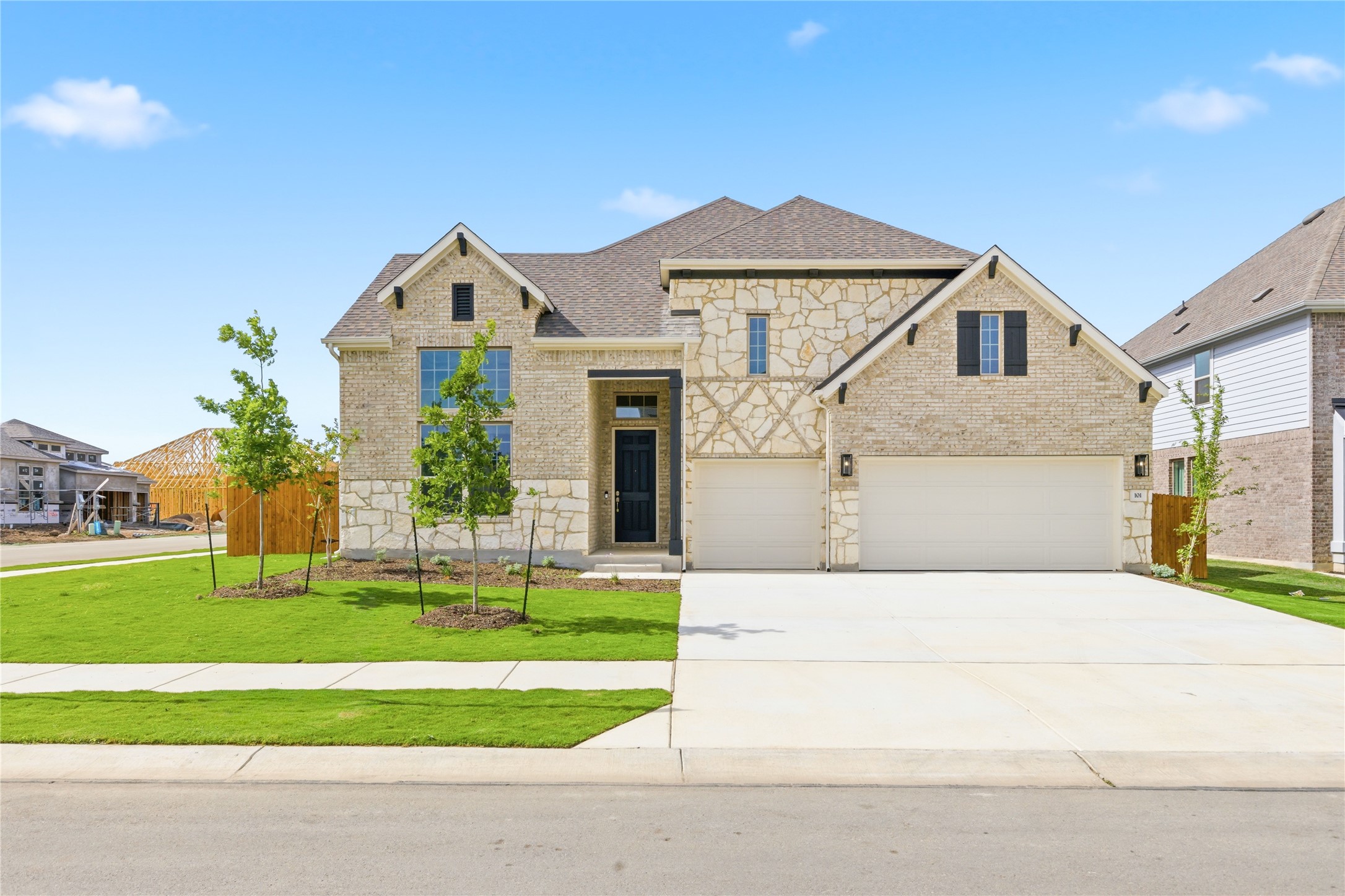 101 Lost Treasure Terrace Georgetown, TX 78628 - Photo 1 of 32 a front view of a house with a yard and garage