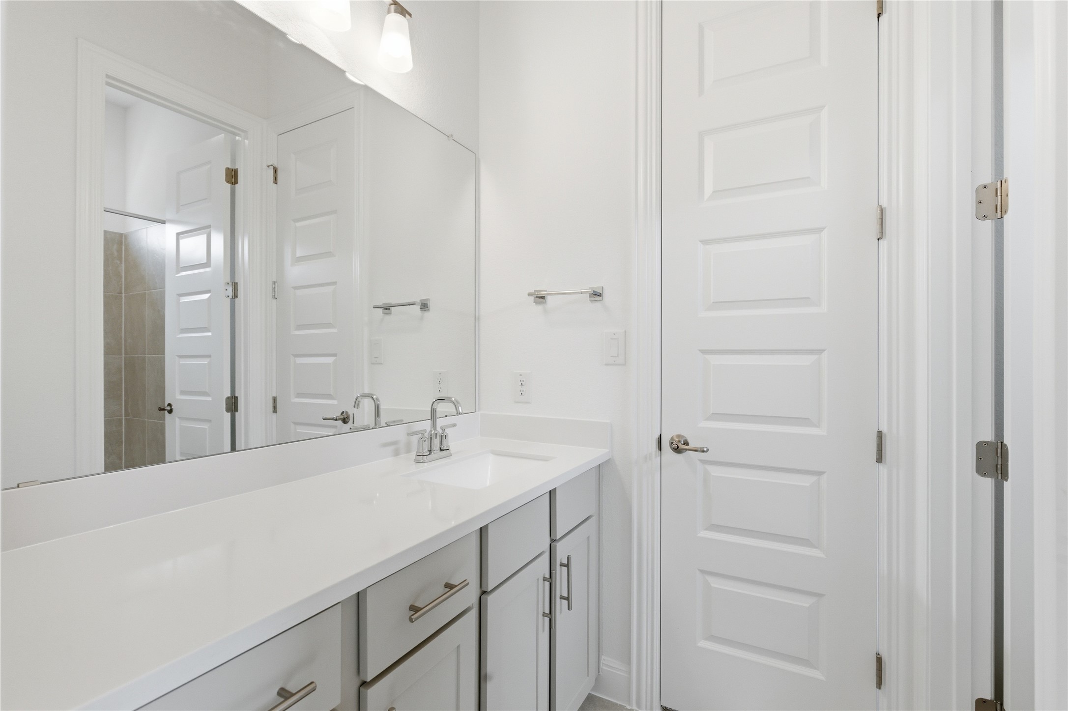 101 Lost Treasure Terrace Georgetown, TX 78628 - Photo 27 of 32 a bathroom with a sink and a mirror