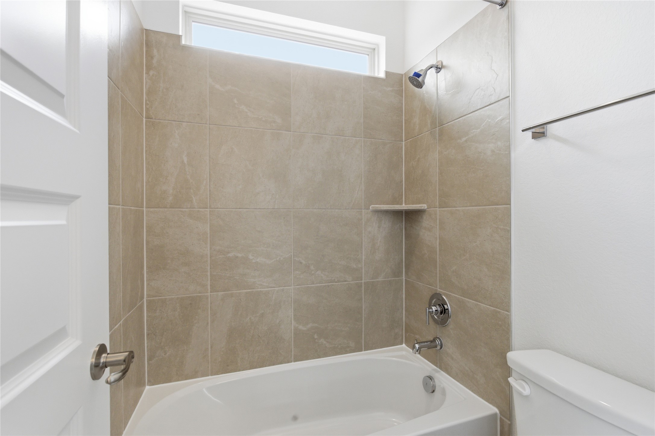 101 Lost Treasure Terrace Georgetown, TX 78628 - Photo 28 of 32 a bathroom with a shower and a toilet