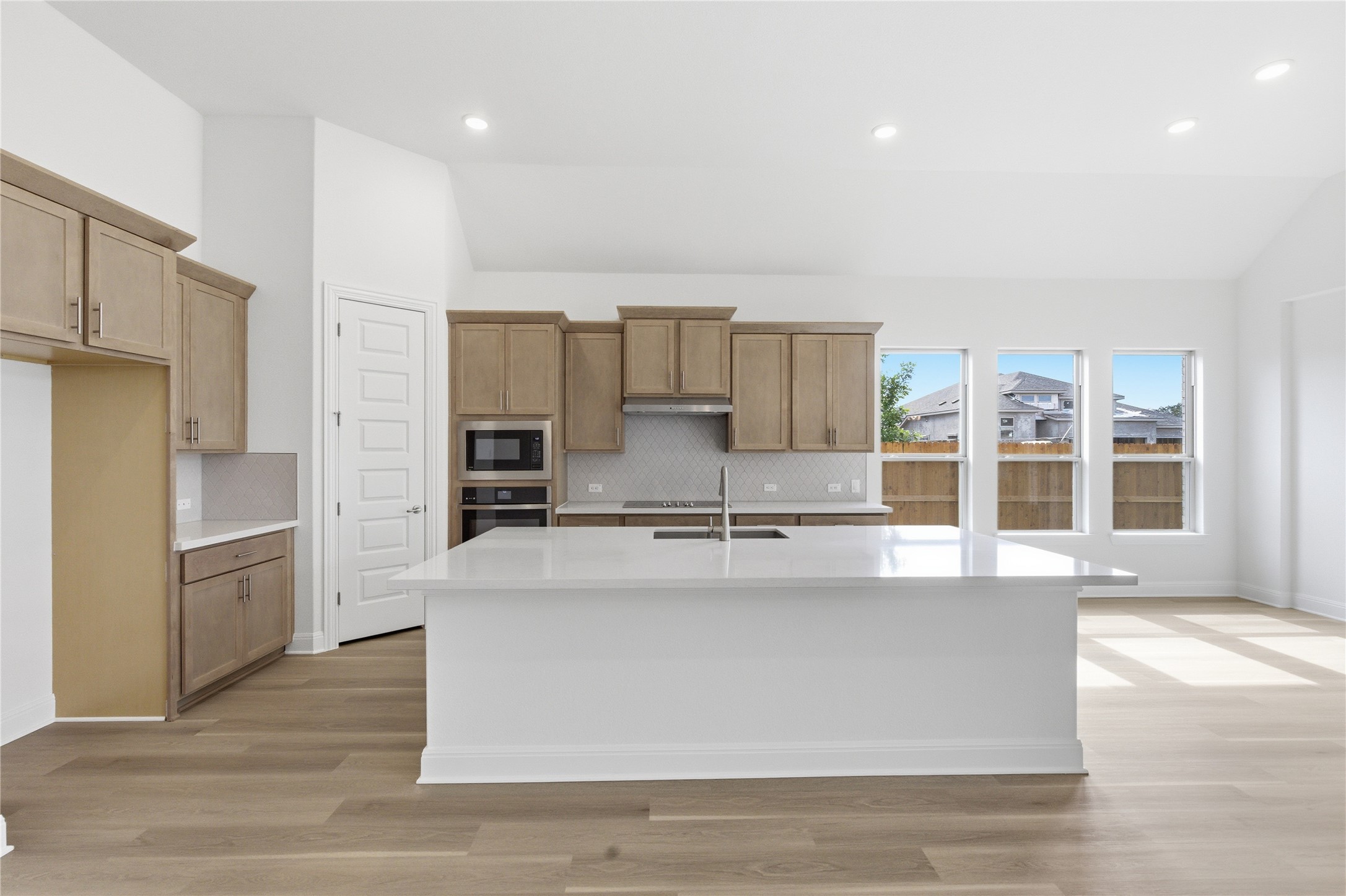 101 Lost Treasure Terrace Georgetown, TX 78628 - Photo 3 of 32 a large kitchen with stainless steel appliances