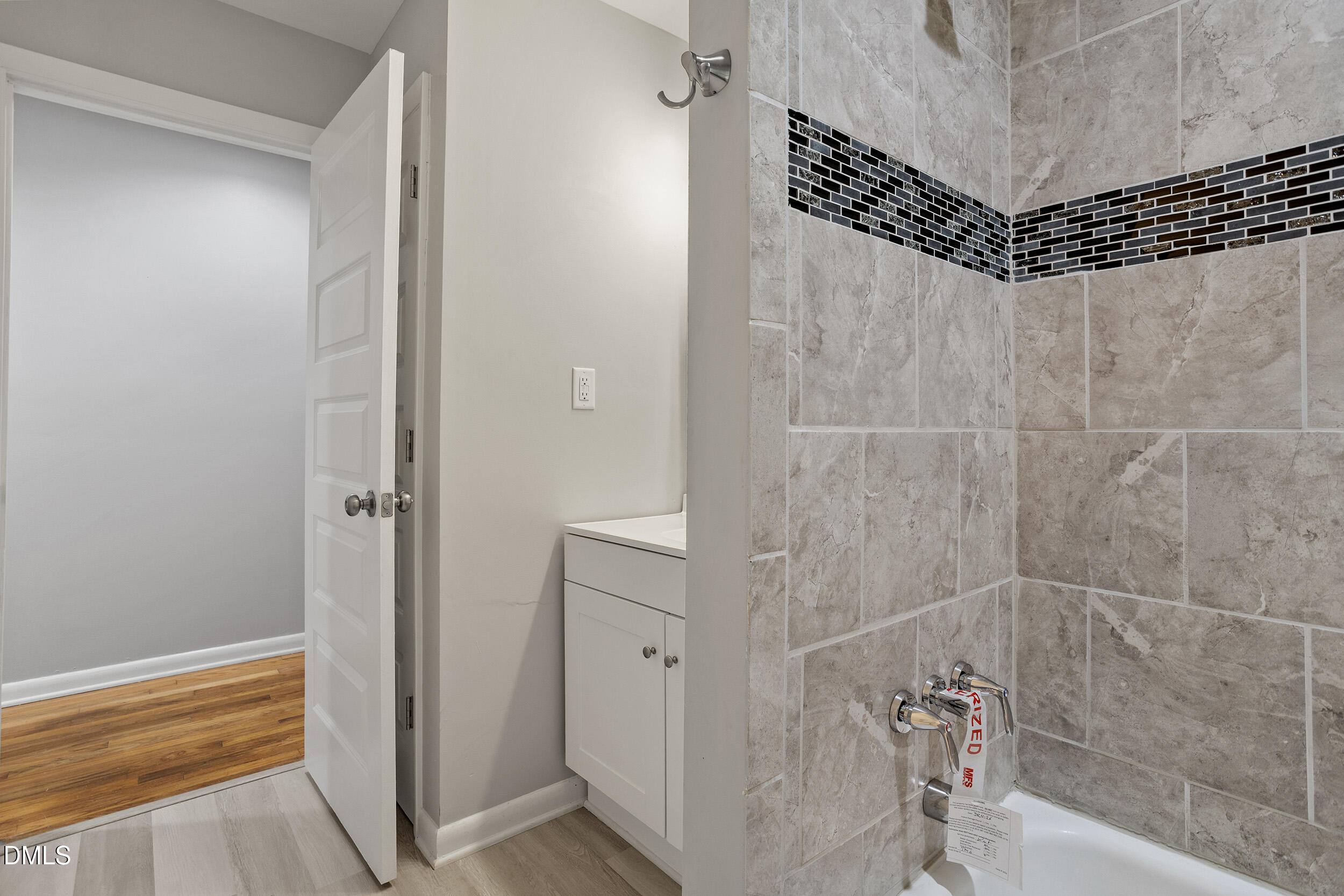 2414 Chapin Street Durham, NC 27707 - Photo 26 of 30 a bathroom with a shower and a sink
