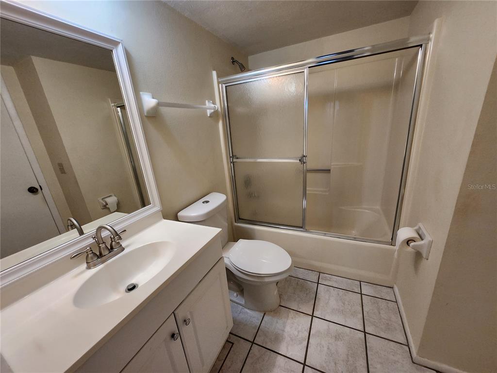 6800 Placida Road, Unit 1004 Englewood, FL 34224 - Photo 14 of 26 a bathroom with a sink toilet and shower