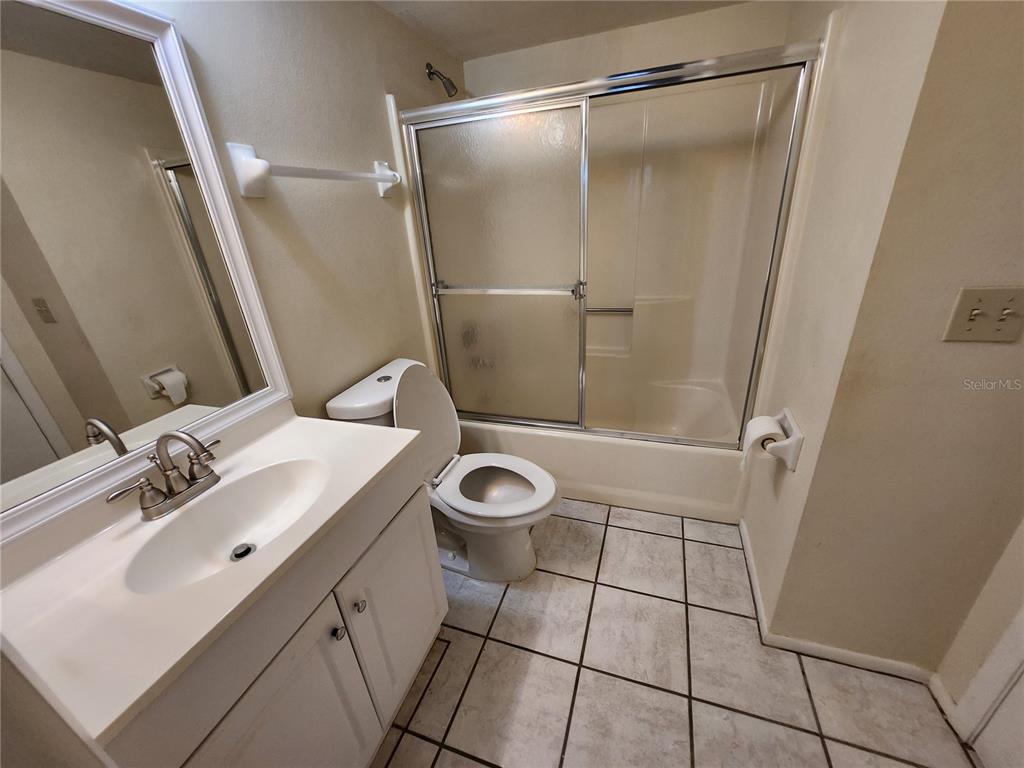 6800 Placida Road, Unit 1004 Englewood, FL 34224 - Photo 15 of 26 a bathroom with a sink toilet and shower