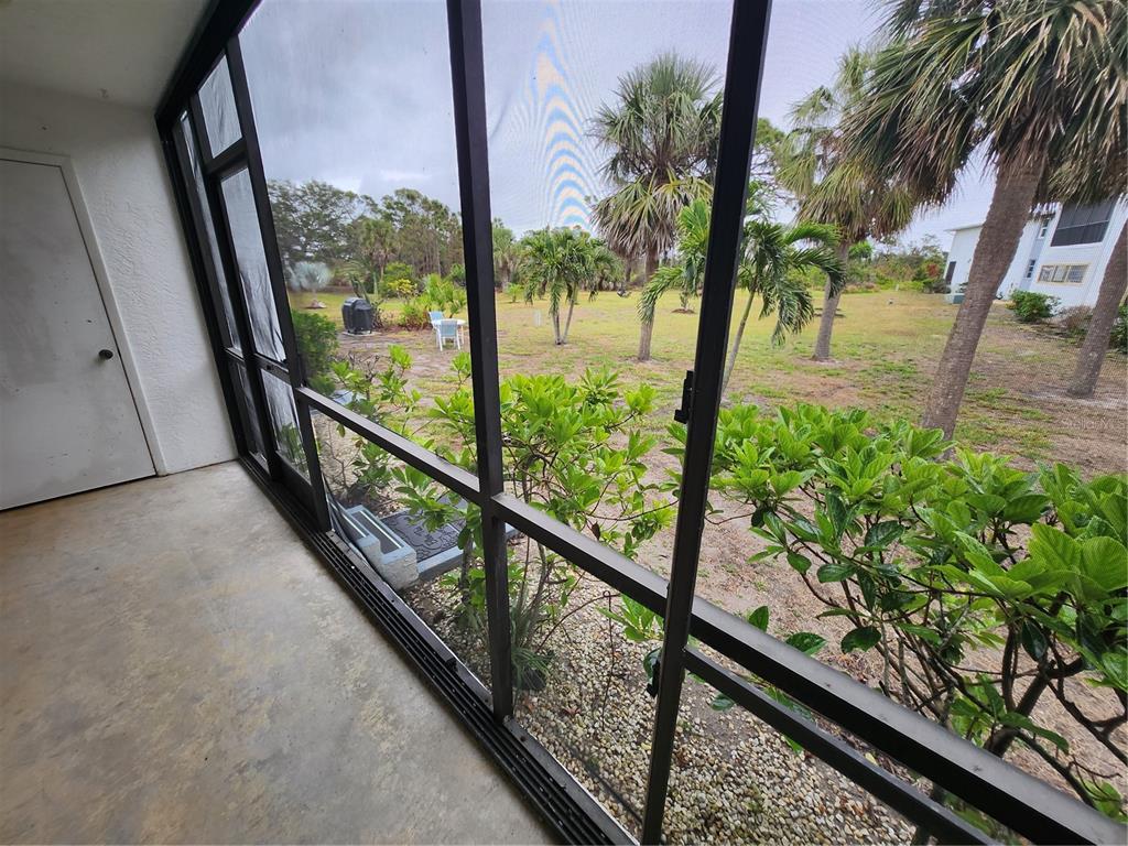6800 Placida Road, Unit 1004 Englewood, FL 34224 - Photo 16 of 26 a view of balcony with wooden floor and fence