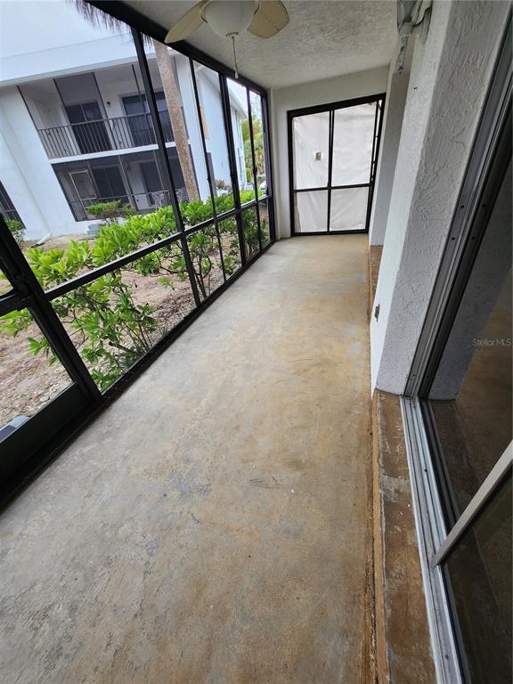 6800 Placida Road, Unit 1004 Englewood, FL 34224 - Photo 19 of 26 a view of staircase with large window