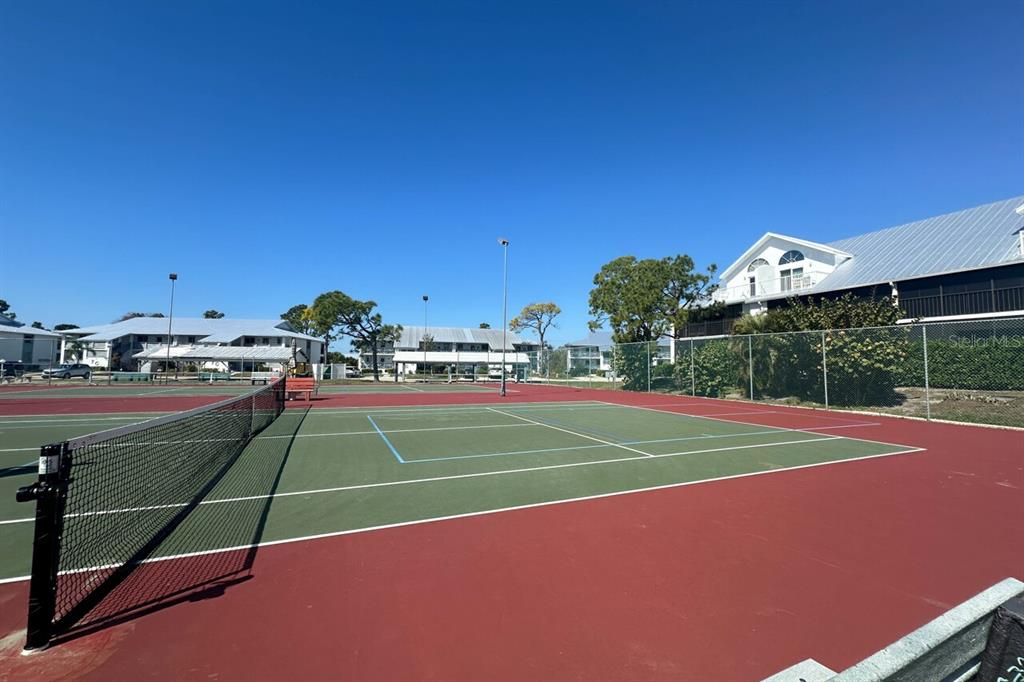 6800 Placida Road, Unit 1004 Englewood, FL 34224 - Photo 20 of 26 a view of a tennis court