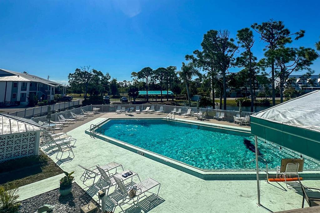 6800 Placida Road, Unit 1004 Englewood, FL 34224 - Photo 25 of 26 a view of a swimming pool with a patio