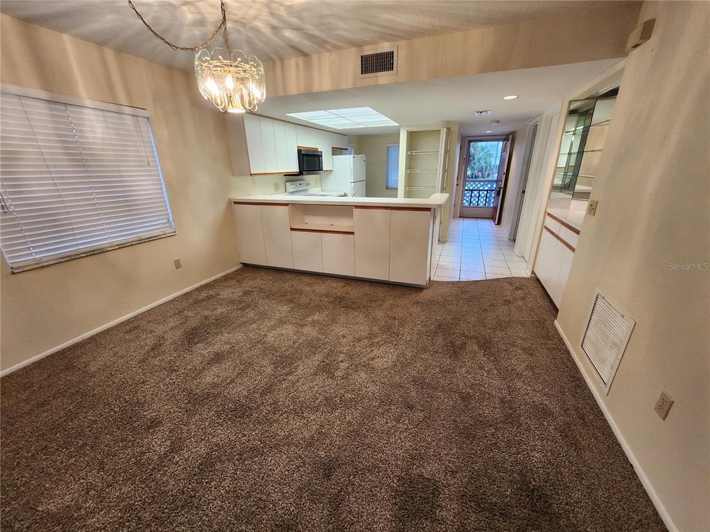 6800 Placida Road, Unit 1004 Englewood, FL 34224 - Photo 6 of 26 an entryway with a window and fireplace