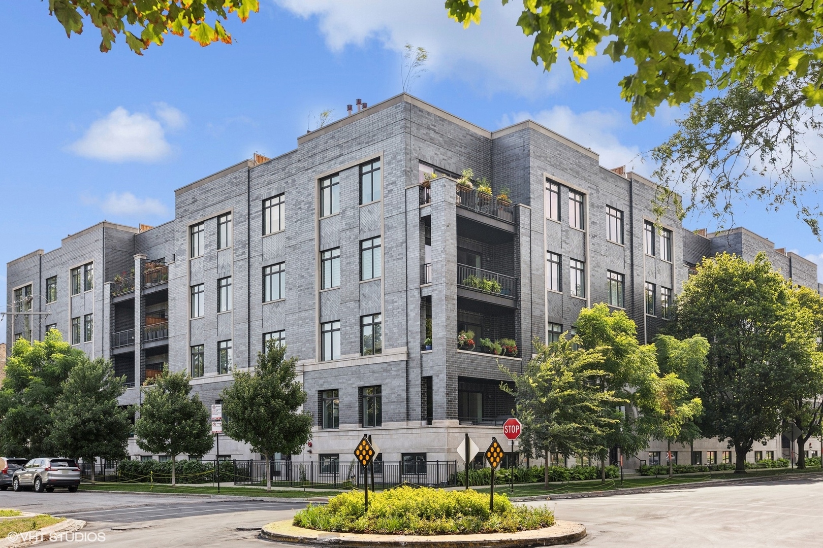 5748 North Hermitage Avenue, Unit 102 Chicago, IL 60660 - Photo 1 of 34 a view of a building with a garden and pathway