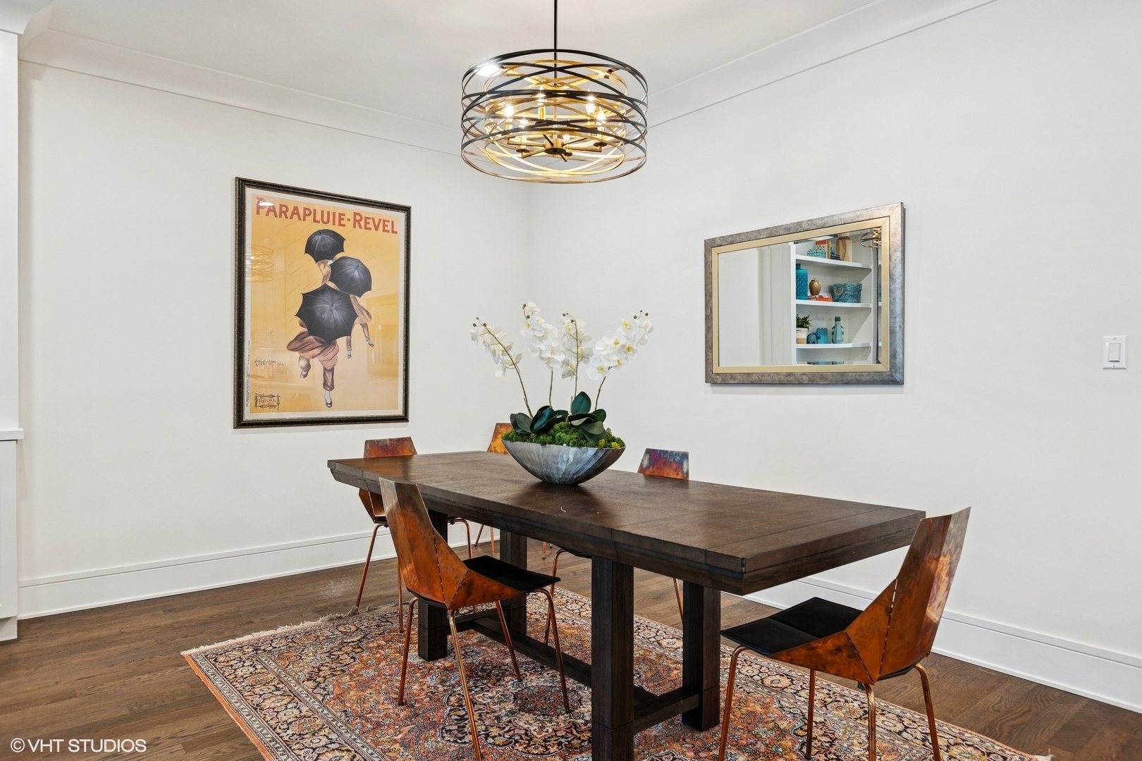5748 North Hermitage Avenue, Unit 102 Chicago, IL 60660 - Photo 11 of 34 a dining room with table and paintings on the wall