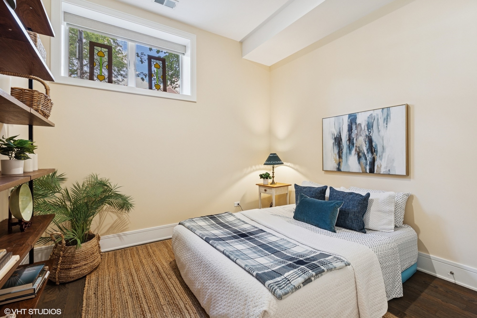 5748 North Hermitage Avenue, Unit 102 Chicago, IL 60660 - Photo 22 of 34 a bedroom with bed and wooden floor