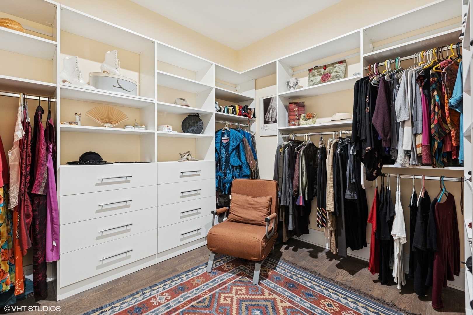 5748 North Hermitage Avenue, Unit 102 Chicago, IL 60660 - Photo 28 of 34 a view of walk in closet with clothes and shoes