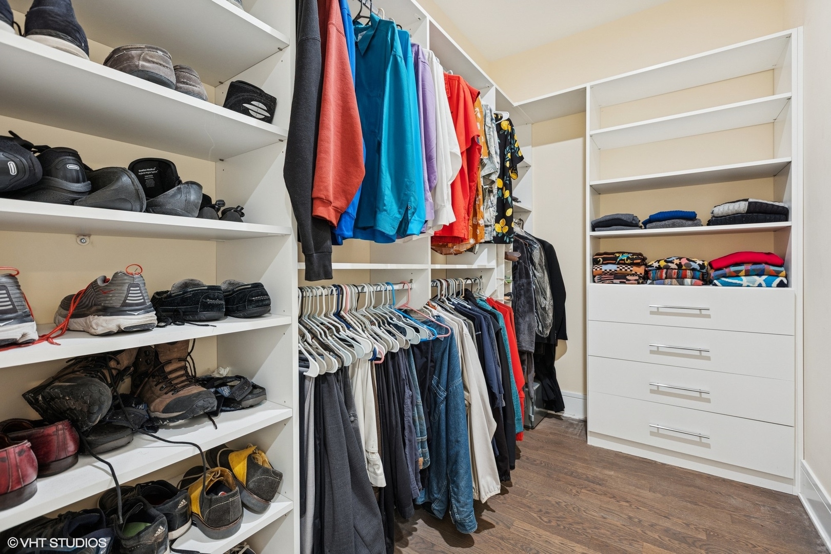 5748 North Hermitage Avenue, Unit 102 Chicago, IL 60660 - Photo 29 of 34 a view of walk in closet with clothes and shoes