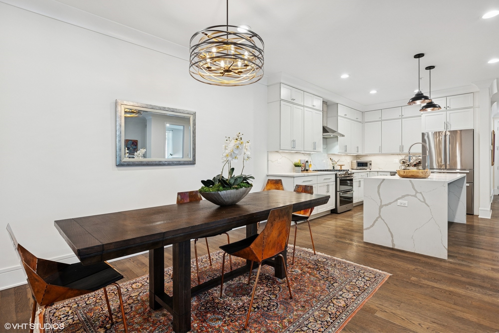 5748 North Hermitage Avenue, Unit 102 Chicago, IL 60660 - Photo 10 of 34 a view of a dining room with furniture