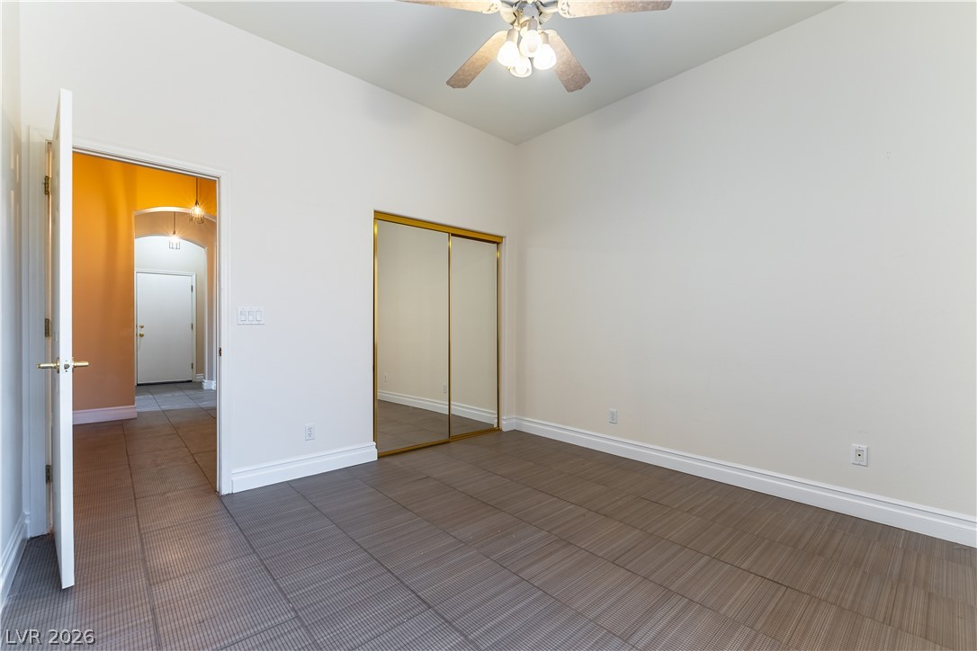 3334 Garden Shower Place Las Vegas, NV 89135 - Photo 12 of 32 Textured tile flooring and high ceilings define this versatile bedroom space.