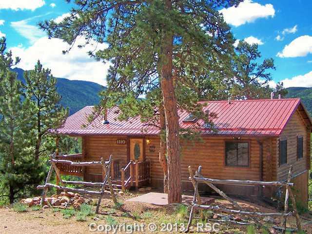 1110 Timber Ridge Road Divide, CO 80814 - Photo 1 of 20 True Log Home surrounded by Purple Mountain Majesty. Views from every window in this Mountain Retreat!