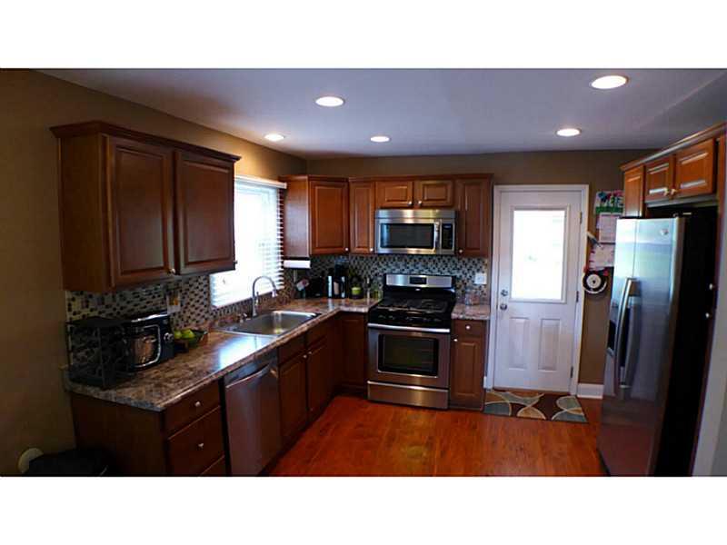 29 Ewing Road McKees Rocks, PA 15136 - Photo 2 of 24 Kitchen. Amazing kitchen with stainless steel appliances, HD laminate counters, tiled back splash, recessed lights, new cabinets, hardwood flooring & MORE!