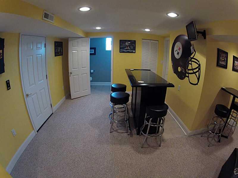 29 Ewing Road McKees Rocks, PA 15136 - Photo 9 of 24 Basement/Game Room. Dry bar, partial bath, recessed lights, & storage.