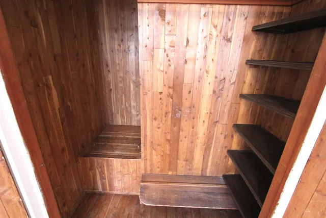 a view of entryway with wooden floor and door