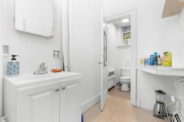 a view of bathroom with a sink and a toilet