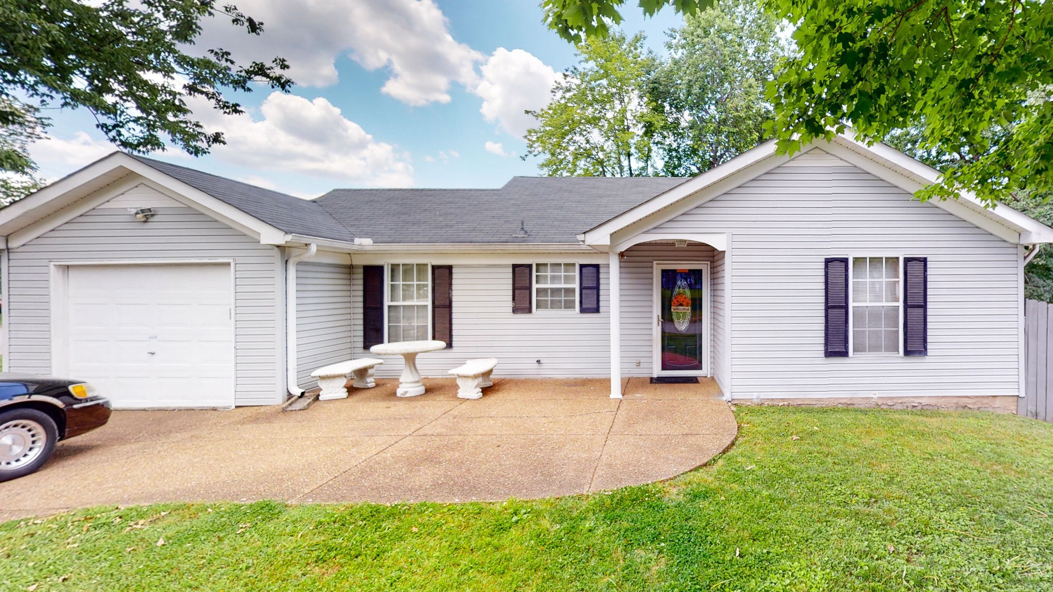 a front view of a house with garden