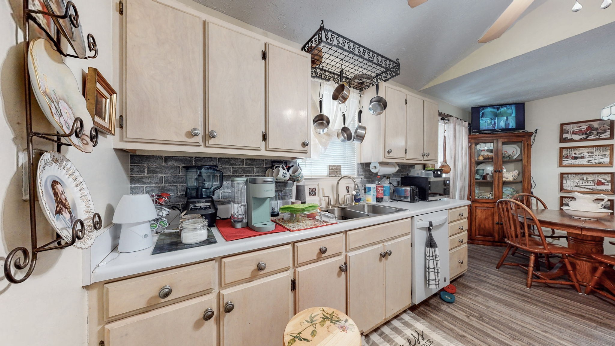 844 Trailside Circle Antioch, TN 37013 - Photo 13 of 27 a kitchen with stainless steel appliances granite countertop a sink and cabinets
