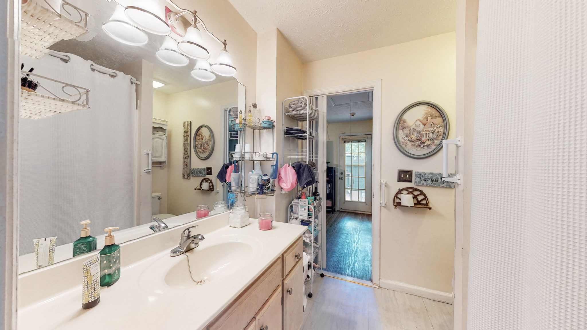 844 Trailside Circle Antioch, TN 37013 - Photo 18 of 27 a bathroom with a sink vanity and a mirror