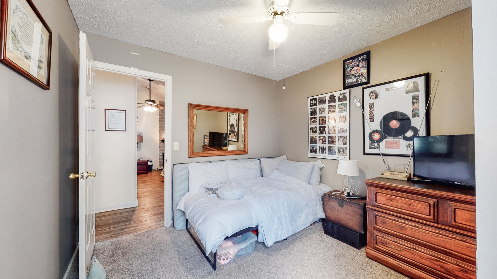 844 Trailside Circle Antioch, TN 37013 - Photo 20 of 27 a bedroom with a bed and a flat tv screen on dresser
