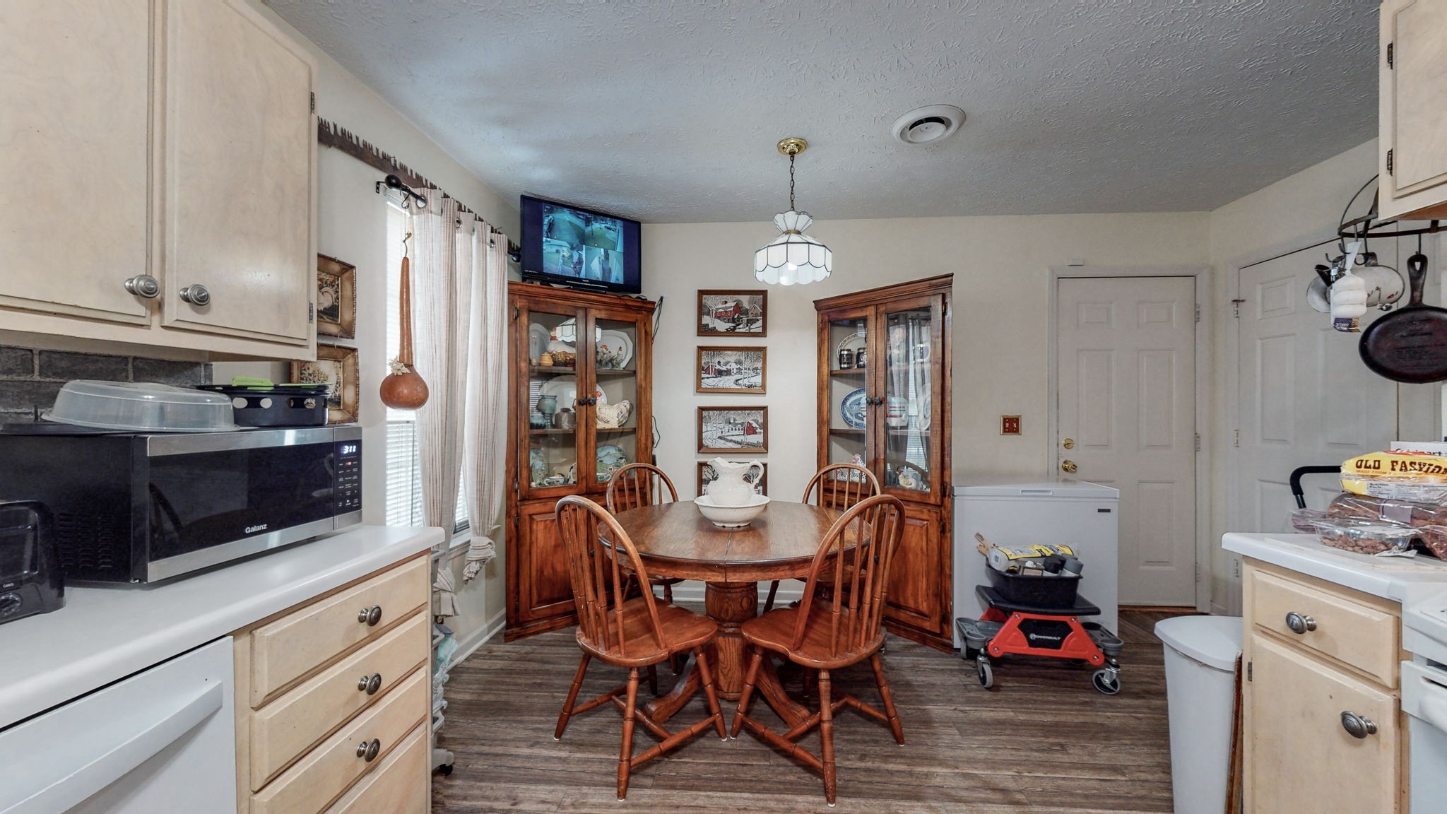 844 Trailside Circle Antioch, TN 37013 - Photo 8 of 27 a view of a dining room with furniture and wooden floor
