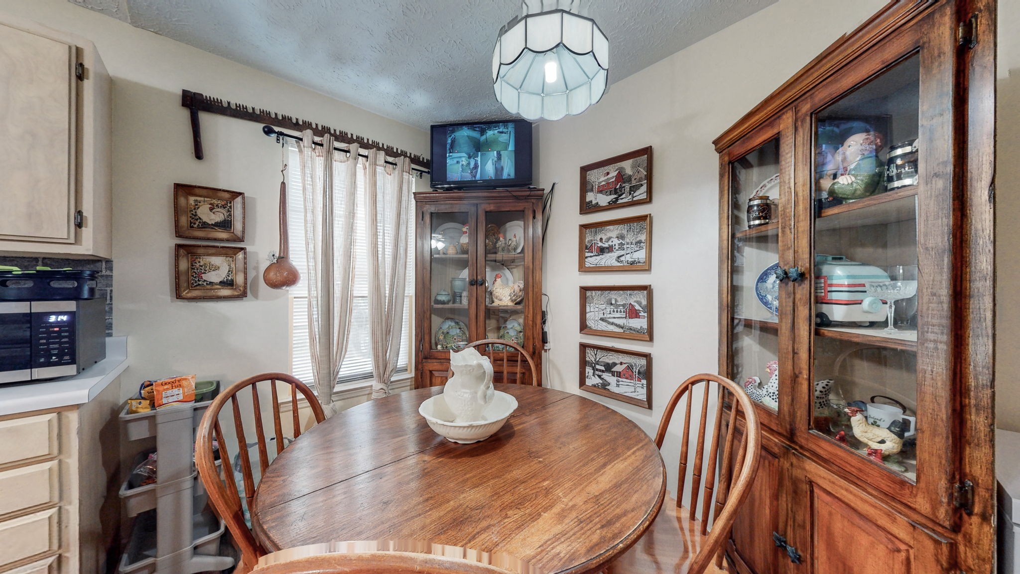 844 Trailside Circle Antioch, TN 37013 - Photo 10 of 27 a view of a dining room with furniture a chandelier and wooden floor
