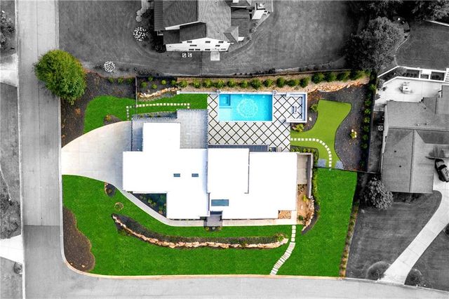 a living room with furniture flowerpot and window