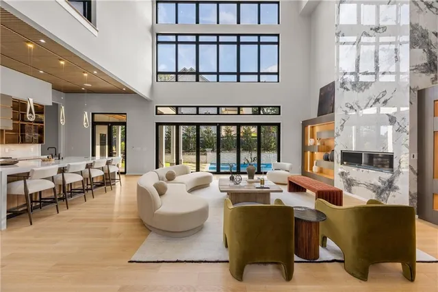 a kitchen with granite countertop a sink and a refrigerator