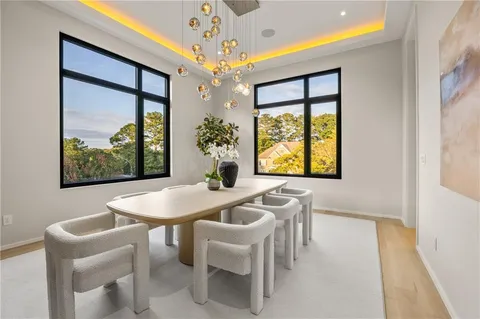 a en suite bathroom with a granite countertop sink and a mirror