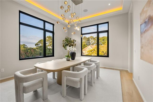 a en suite bathroom with a granite countertop sink and a mirror