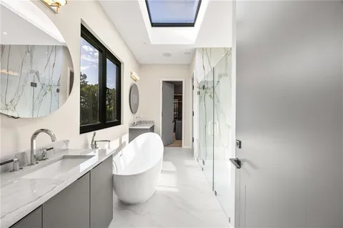 a view of a house with swimming pool and sitting area