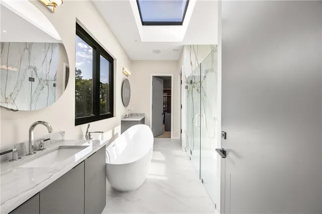 a view of a house with swimming pool and sitting area