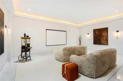 a living room with furniture and large windows