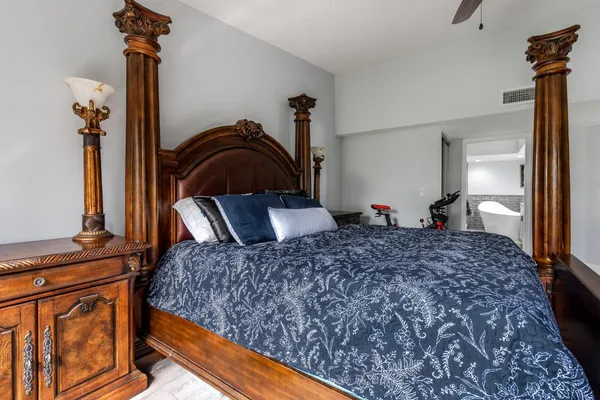 a bedroom with bed and a dresser