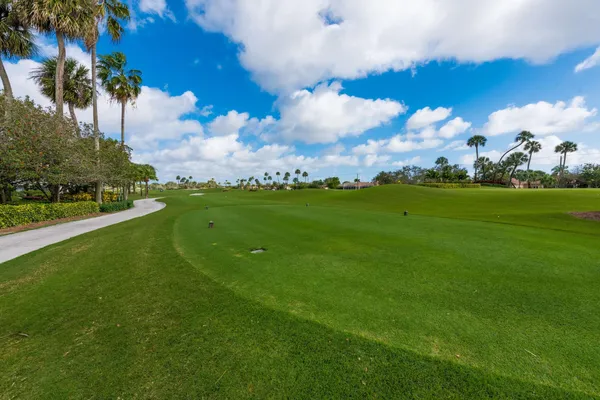 a view of a golf course with a big yard