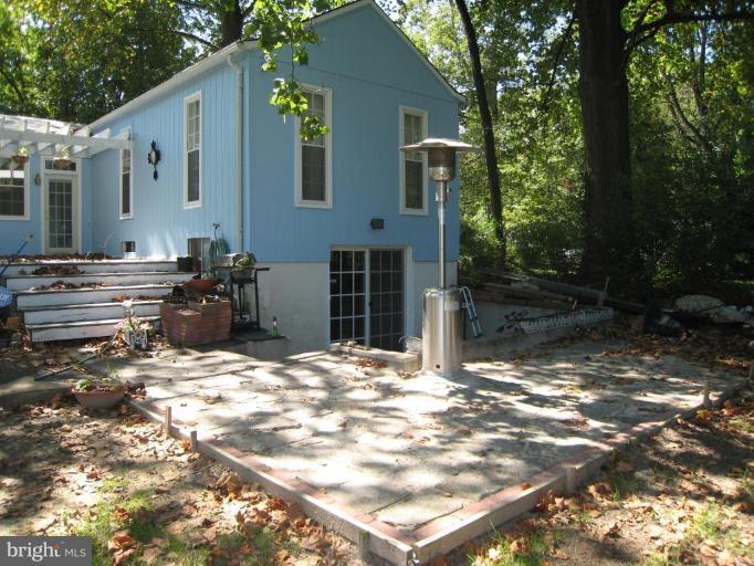 1908 Poplar Road Essex, MD 21221 - Photo 22 of 26 a backyard of a house with yard and outdoor seating