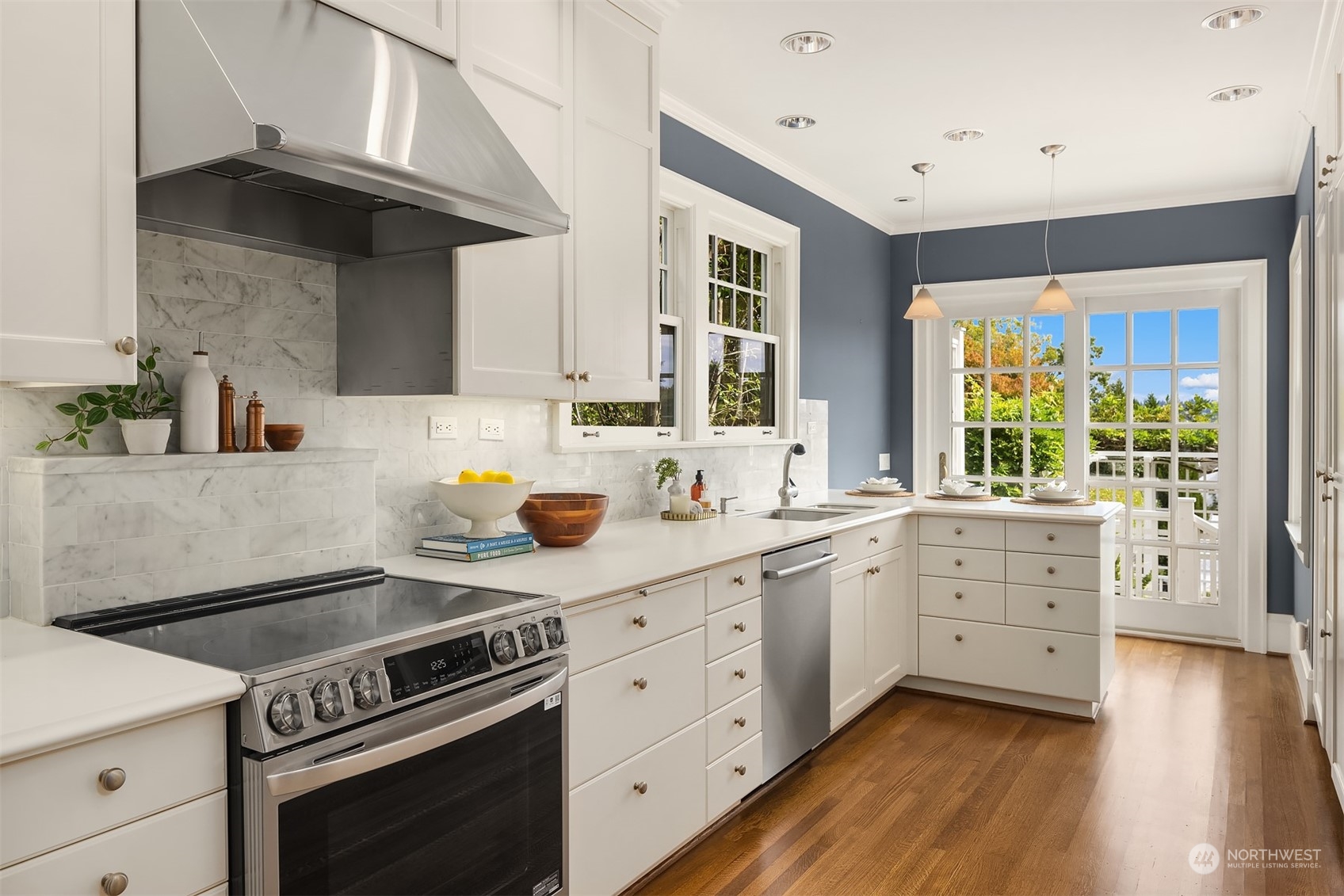 2230 33rd Avenue South Seattle, WA 98144 - Photo 11 of 39 a kitchen with a stove a sink and wooden floor