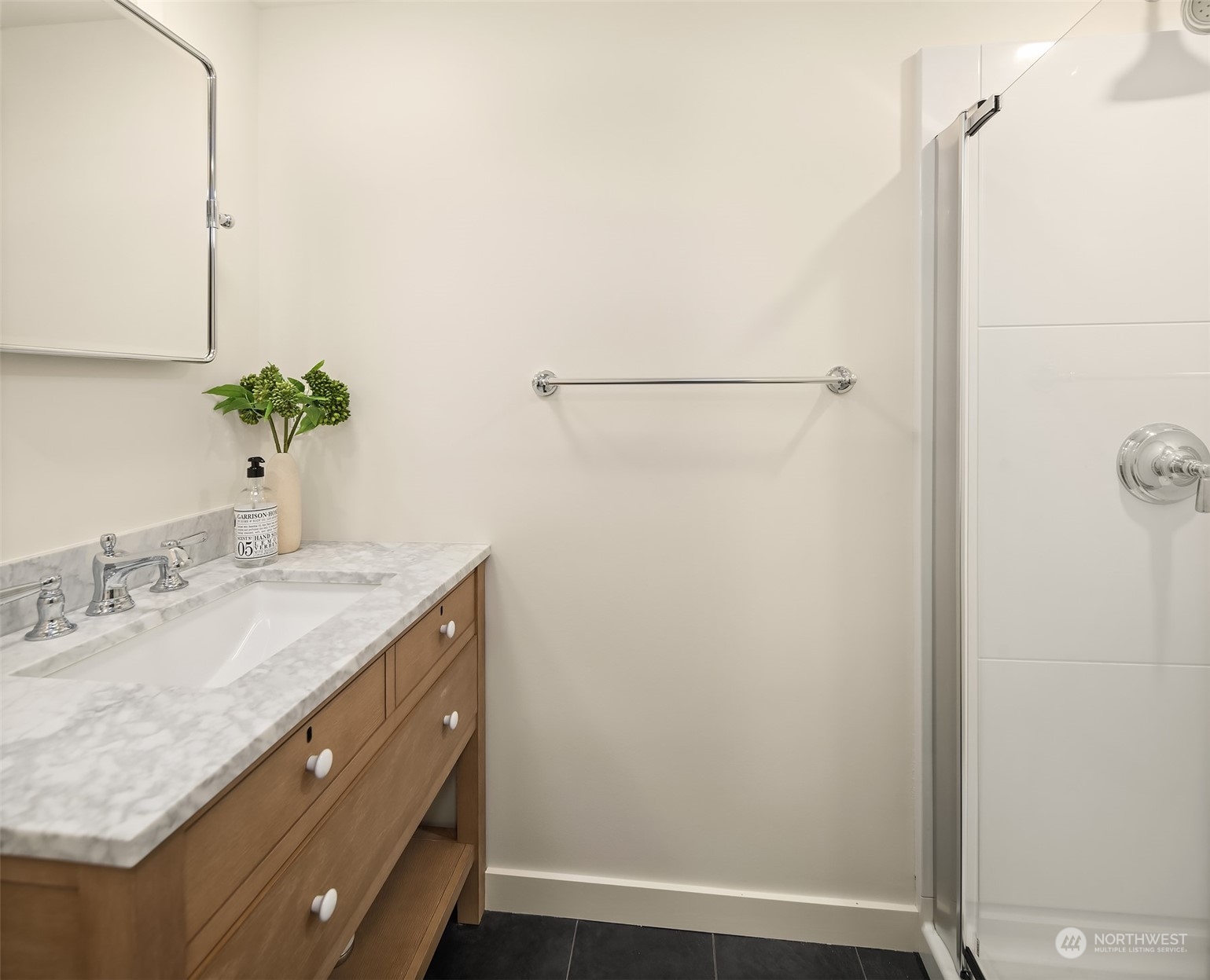 2230 33rd Avenue South Seattle, WA 98144 - Photo 26 of 39 a bathroom with a granite countertop sink and a mirror