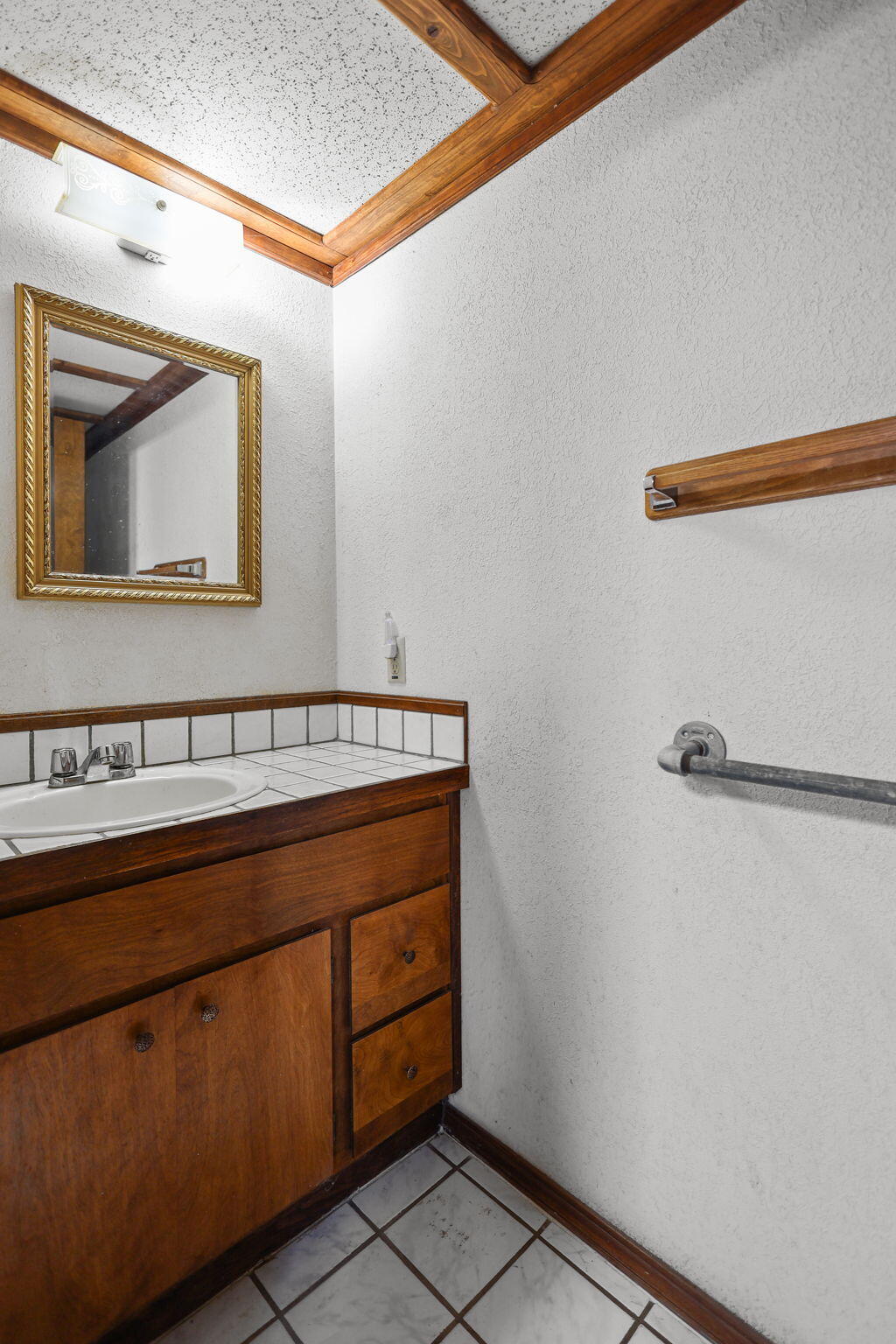 28424 Alpine Way Shingletown, CA 96088 - Photo 11 of 42 a bathroom with a sink and a mirror