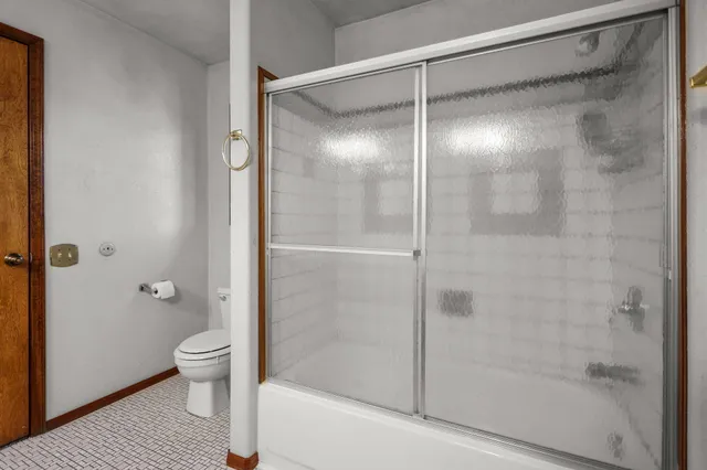 a view of a hallway with windows