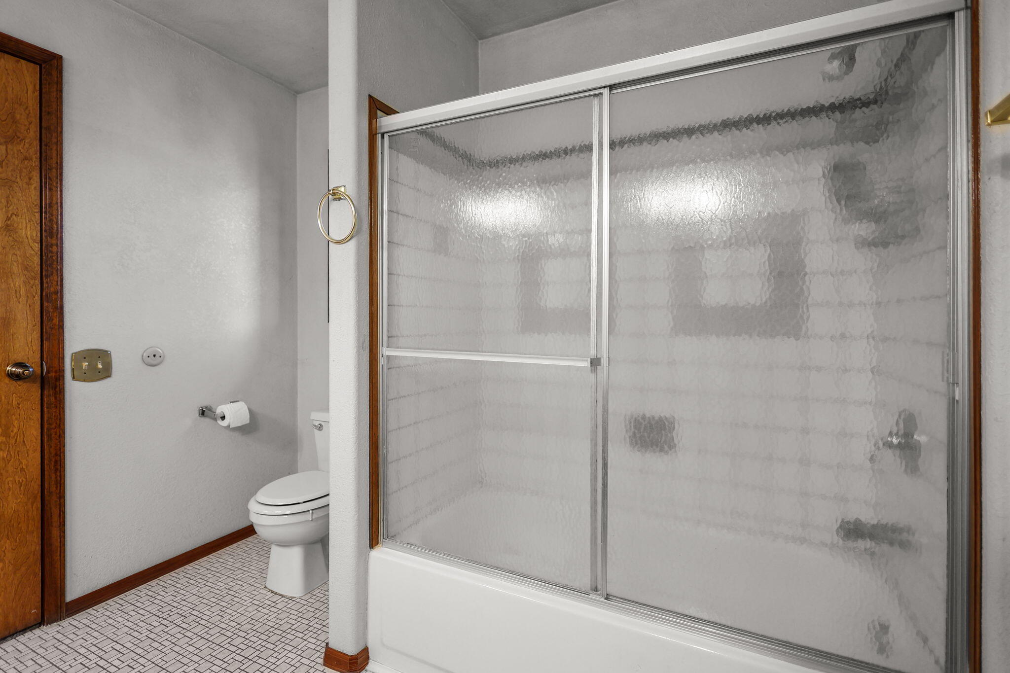 28424 Alpine Way Shingletown, CA 96088 - Photo 15 of 42 a bathroom with a glass shower door