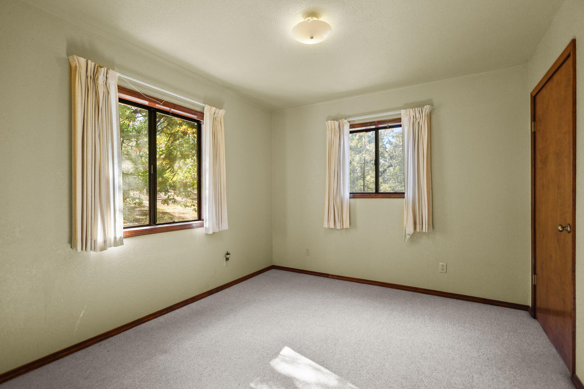 28424 Alpine Way Shingletown, CA 96088 - Photo 16 of 42 an empty room with a window