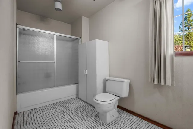 a view of an empty room with a window