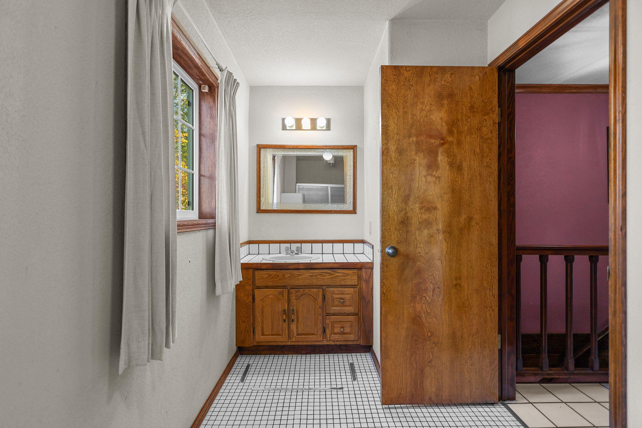 28424 Alpine Way Shingletown, CA 96088 - Photo 19 of 42 a bathroom with a sink a mirror and a shower
