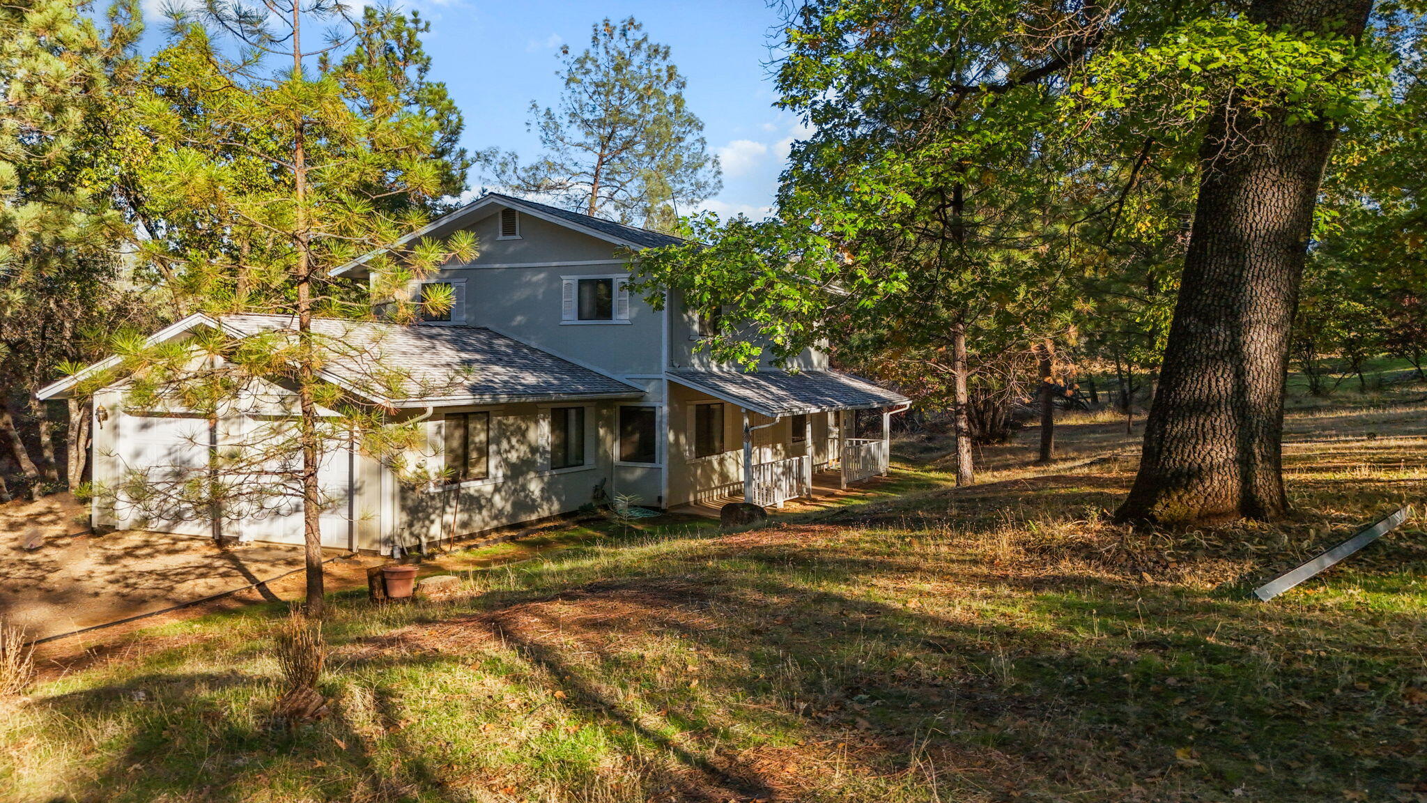 28424 Alpine Way Shingletown, CA 96088 - Photo 2 of 42 a view of a house with a yard